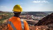 © VideoMeile - Portrait of black male construction worker from behind wearing helmet at construction site