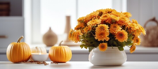 Canvas Print - Autumn Halloween decor flowers pumpkin candles on a tray in a Scandi style white kitchen evoking home and comfort with copyspace for text