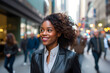 Portrait of a proud, confident African American woman business executive walking on a downtown New York City
