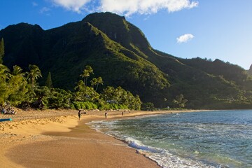 Wall Mural - Taking a sunset dip at Tunnels and Ha'ena Beaches, located at the end of Kuhio Highway in Kauai, Hawaii.