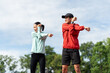 © Chanakon - Couple asian jogging and running outdoors at sport stadium warming up stretching before workout. Happy healthy Man woman wearing sportswear jogging. Workout exercise Healthy and lifestyle.