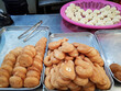 Various fried foods at a traditional market