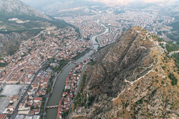 Wall Mural - Amasya,TURKEY old riverside Turkish(ottoman) city buildings and its reflection on water,sunny summer day.Amasya is city of princes of ottoman. ottoman Princes were educated in Amasya