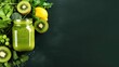 Glass bottle with green smoothie, kale leaves, lemon, apple, kiwi, grapes, banana, avocado, lettuce With space for text