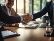 © mariyana_117 - close-up handshake between an executive and a partner in a corporate office