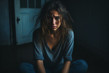 Dramatic Portrait Of Girl Sits In A Dark Room And Suffers A Mental Breakdown - Depression
