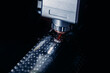 CNC industrial Automatic laser cutting machine for square metal profile, splashes of bright sparks