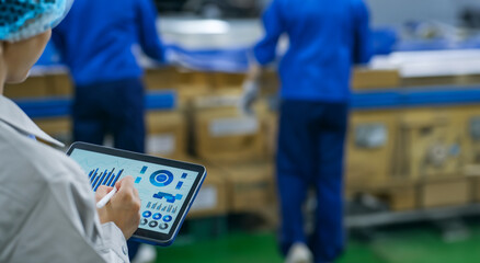 Aufkleber - Workers using tablets at a distribution center.