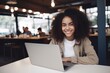 © CYBERUSS - Portrait of Beautiful Black Female Student Learning Online in Coffee Shop, Young African American Woman Studies with Laptop in Cafe, Doing Homework