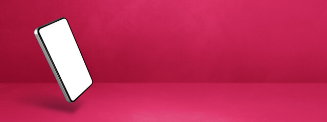 Wall Mural - Floating smartphone isolated on pink. Horizontal banner background