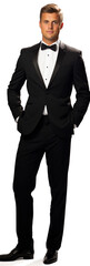 Handsome young white man groom with wedding black suit and bow tie isolated on white background