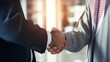 © Maneerat - Arabian man in white suit handshake with business man after finishing up meeting, partnership, teamwork, community, connection financial and investment concept.Generative AI