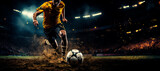 Fototapeta Sport - panorama of soccer player kicking towards goal in football stadium at night