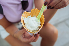 Hands Of Woman Holding Ice Cream Cone