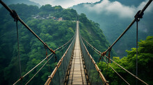 A Suspension Bridge Spanning A Deep Mountain Gorge, Offering A Thrilling View Of The Churning River Below