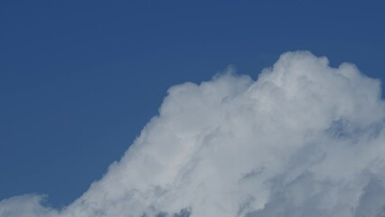 Wall Mural - Movement of beautiful clouds in the blue sky, time lapse video. Nice nature background for your projects.