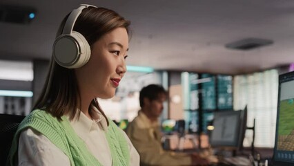 Wall Mural - Close Up Of Asian Female Game Designer Using Desktop Computer, Designing Unique World And Characters In 3D modelling Software For Survival Video Game. Woman Working In Game Development Studio Office.