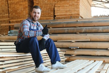 Wall Mural - Carpenter in uniform check boards on sawmill