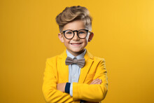 Happy Schoolboy Or Smart Little Student Boy In Suit Portrait On Yellow Background. Back To School