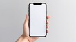 Smartphone with a plain white screen is being held by someone in his left hand. Suitable for technology-themed design mockups, mobile app advertisements and smartphone accessory promotional material