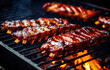 bbq pork ribs cooking on flaming grill. grilling baby back pork ribs over flaming grill