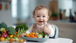© Свет Лана - A small smiling child with a variety of vegetables and a full meal on the background of the kitchen.