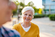 © pikselstock - Portrait of happy senior couple standing in city street on a sunny day