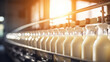 Leinwandbild Motiv Milk bottles filling line in a dairy product factory plant
