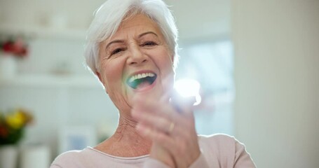 Wall Mural - Happy, laughing and face of senior woman at a home with sweet, cute and positive personality. Smile, excited and portrait of elderly female person in retirement listening to funny comic joke at house