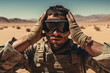 US soldier in the desert during the military operation turning to combat helicopter approaching covering his eyes. Backup is coming