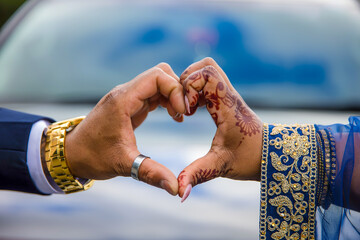 Indian couple's holding hands close up