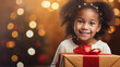 Black african american child with a Christmas present during Christmas time. Little child recieving a Christmas present. Happy child smiling with a present. Christmas tree with lights in the backgroun