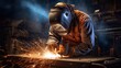 © cherezoff - A masked welder welds parts