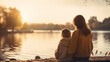 © Kateryna - Mother and Child Sharing a Quiet Sunset by the Lake , with copy space, bokeh
