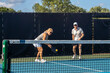 © pics721 - Female Pickleball Player Returning Ball