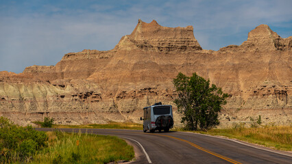 Wall Mural - Traveling in Rv on open road through the badlands of South Dakota on a beautiful day