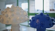 Closeup Beautiful Interior Sculpture Indoors. Creative Blue White Mushrooms