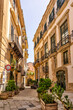 © Torval Mork - Palermo, Italy - July 18, 2022: Classic architecture and building facades on the streets in Palermo