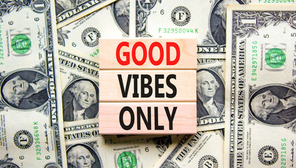 Good vibes only symbol. Concept word Good vibes only on beautiful wooden block. Dollar bills. Beautiful dollar bills background. Business motivational good vibes only concept. Copy space.