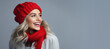 © JJAVA - Beautiful Young Woman with Red Hat and Scarf with Copy Space on a Grey Background