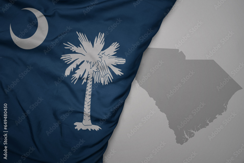big waving national colorful flag and map of south carolina state on ...