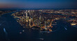 © Tetra Images - Aerial view of lower Manhattan illuminated at night