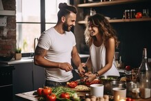 Romantic Couple At The Kitchen With Food Preparing Background.