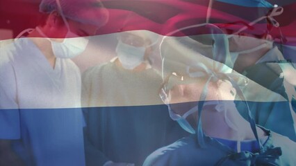 Poster - Animation of waving netherlands flag over team of diverse surgeons performing operation at hospital