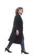 © ASDF - in full growth. confident mature woman taking a step forward.
