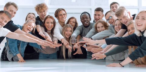 Wall Mural - multinational group of young people joining their palms