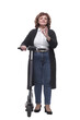 © ASDF - in full growth. modern adult woman with an electric scooter