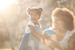 © Anela/peopleimages.com - Love, mother and girl with ball in a park for playing, bond and child development in nature. Toy, smile and kid with funny mom in a forest for fun, freedom and vacation, learning or weekend outdoor