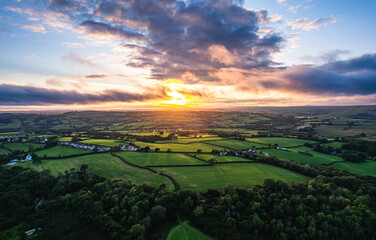 Sticker - Sunset over Fields and Farms from a drone, Green Castle Wood, River Towy, Carmarthen, Wales, England