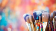 © kichigin19 - bright multicolored creative background, a group of brushes with paint on the background of a multicolored spectrum canvas, the idea of creativity banner, team